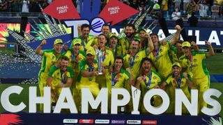 The Australian men's cricket team celebrate winning the 2021 T20 World Cup