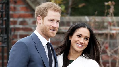 Prince Harry and Meghan Markle pose at Kensington Palace
