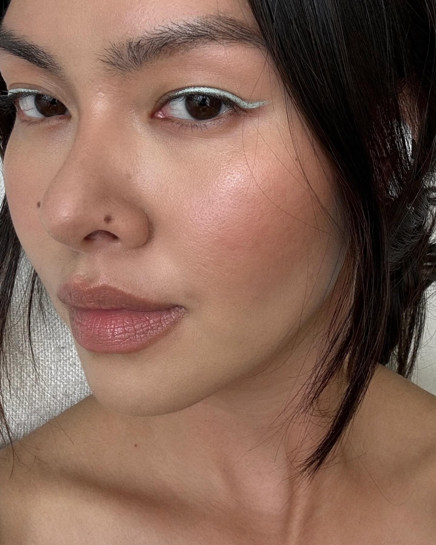 Mimi Nguyen wearing silver eyeliner with no mascara