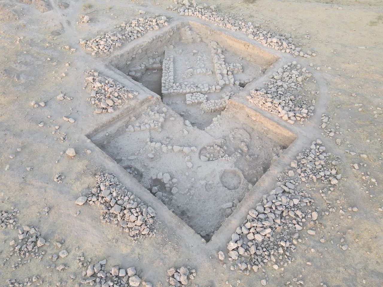 an aerial view of an excavated building