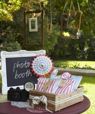 Garden photo booth set p with old fashioned frames and cameras