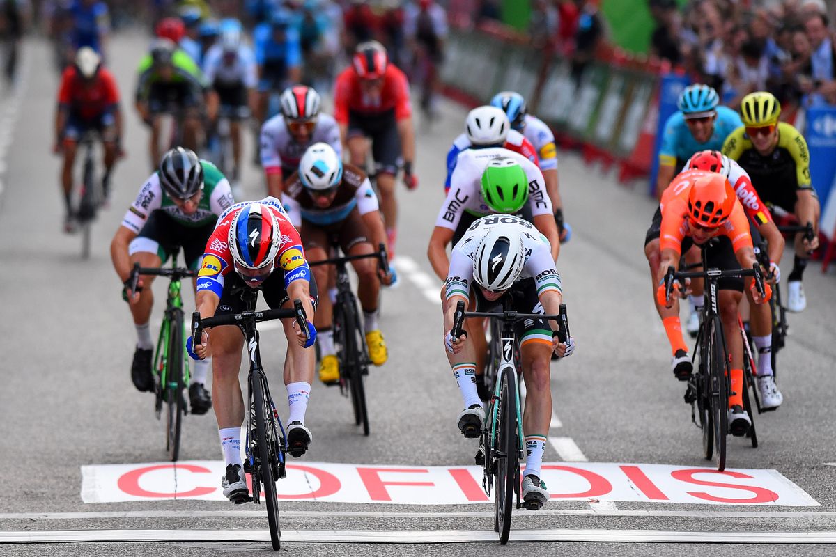 Fabio Jakobsen (left) nudges to the win ahead of Sam Bennett (right)
