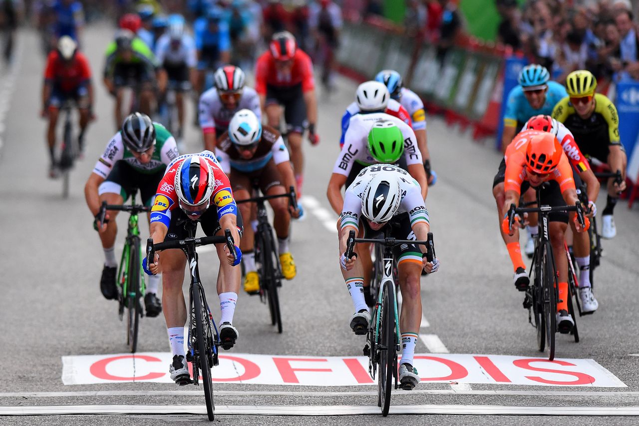 Fabio Jakobsen (left) nudges to the win ahead of Sam Bennett (right)