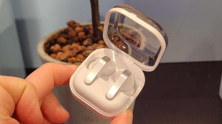 The Samsung Galaxy Buds 4 Pro in their carry case.