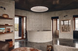round staircase and concrete textures inside house