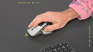 Logitech MX Master 4 Developer Edition in use on a desk next to a keyboard, featuring a gray-and-black design with neon green highlights.