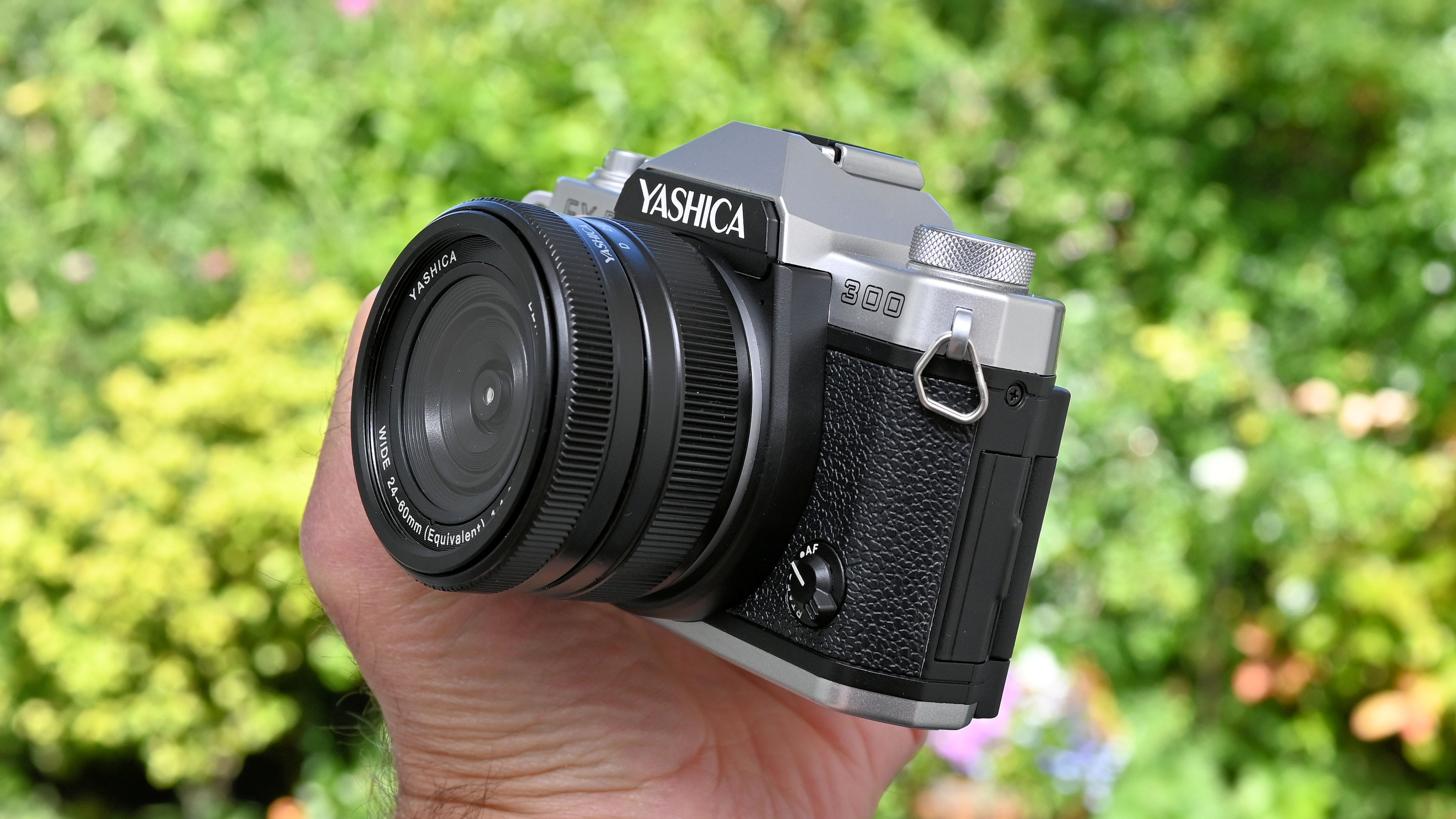 Yashica FX-D 300 product shot, camera held in hand