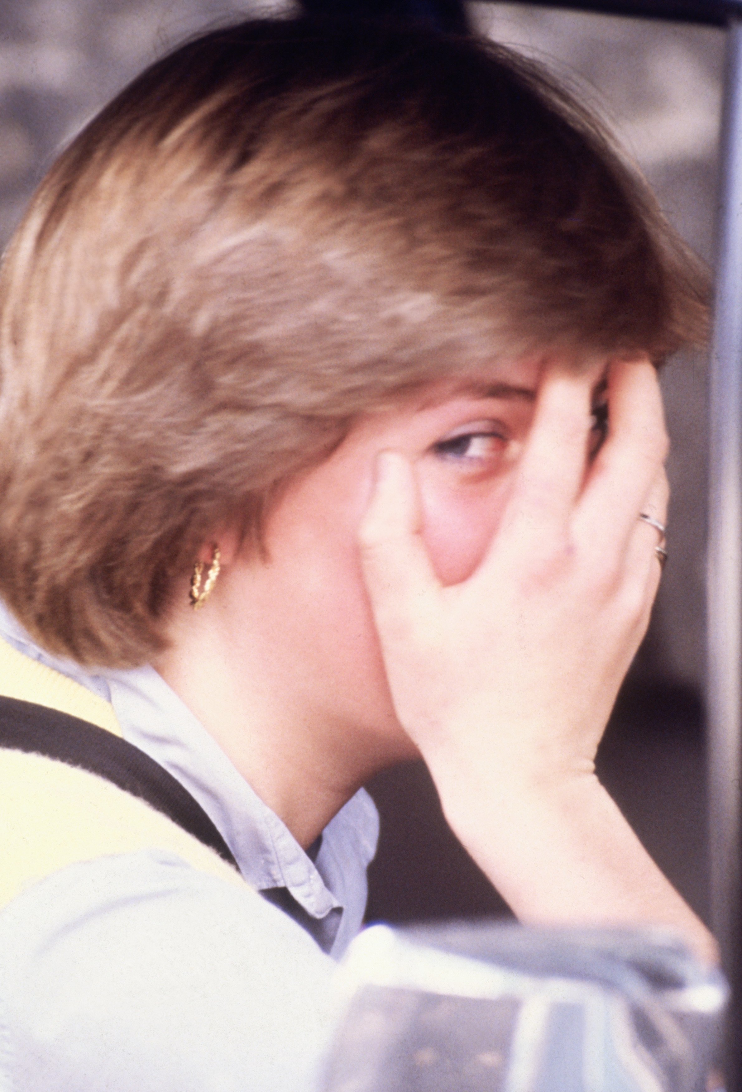 diana - hand over face