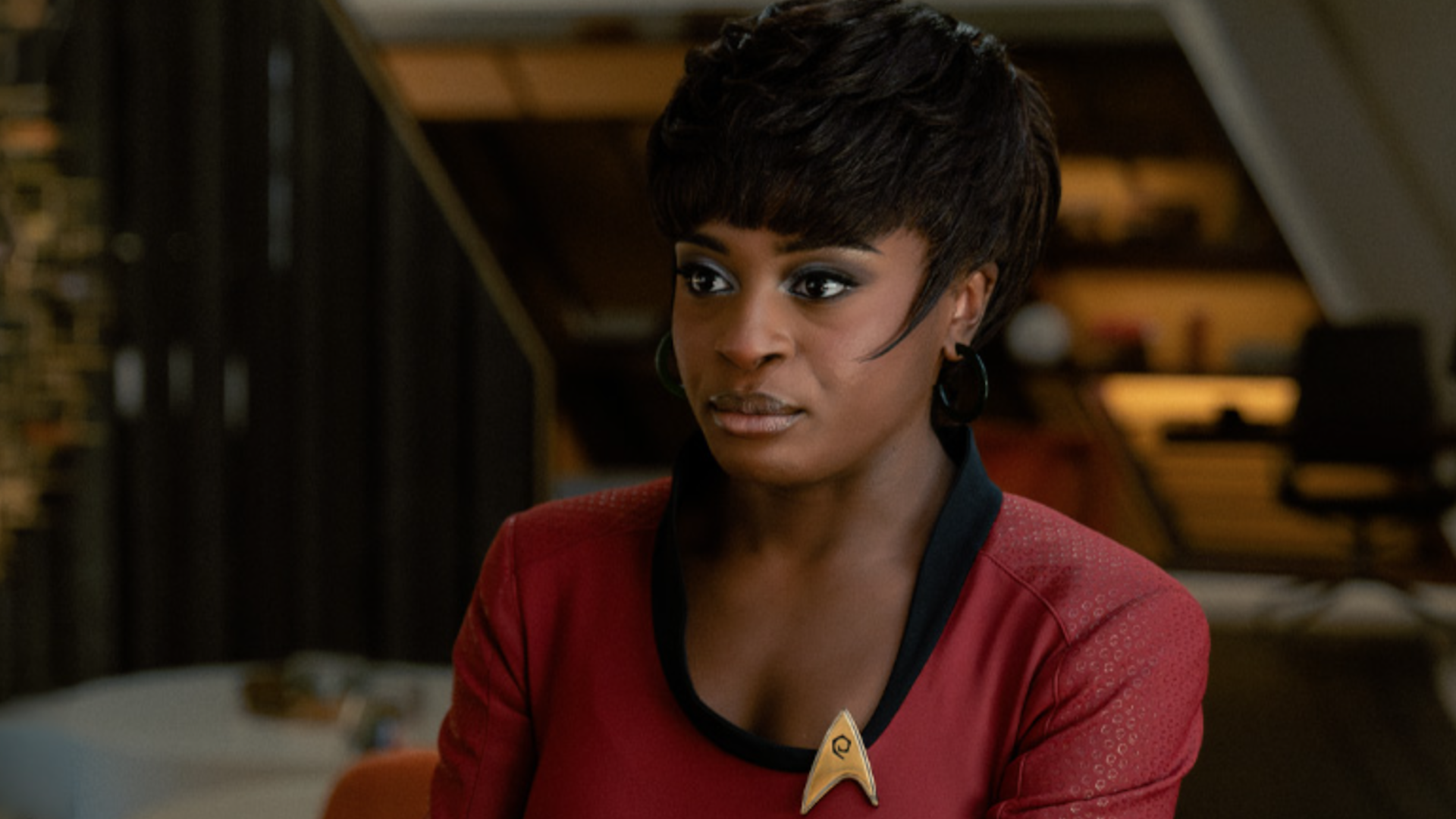 a female character in uniform on a starship