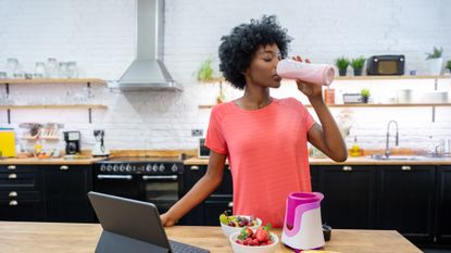 Woman drinking protein powder