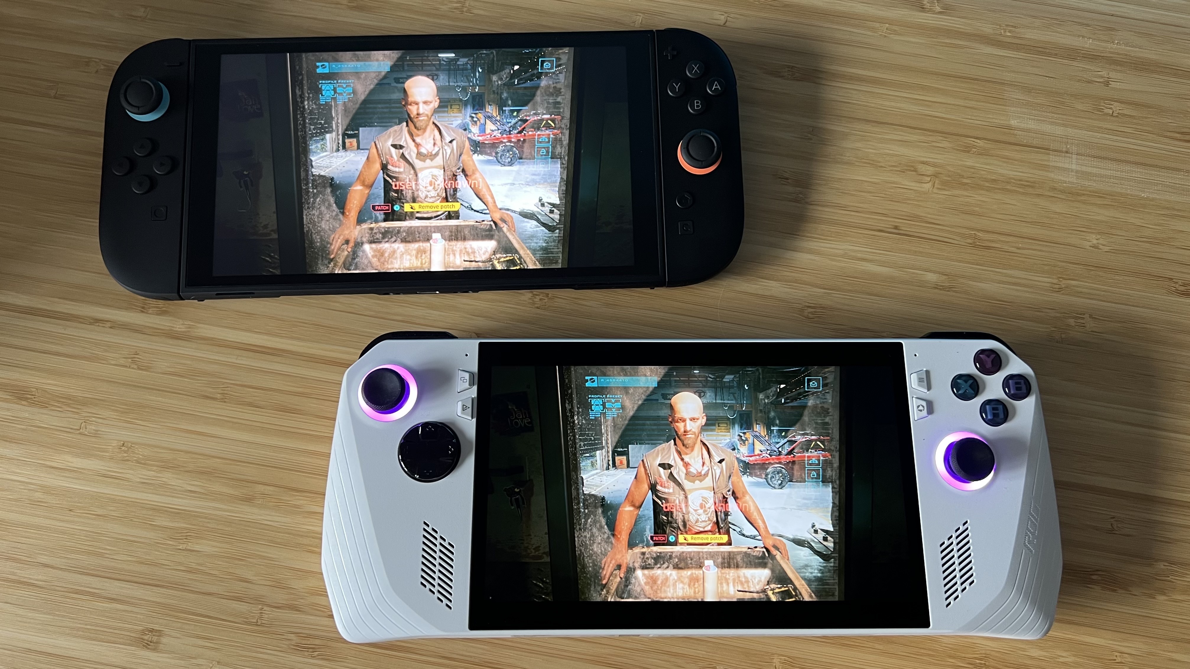 Nintendo Switch 2 and Asus ROG Ally on a wooden desk