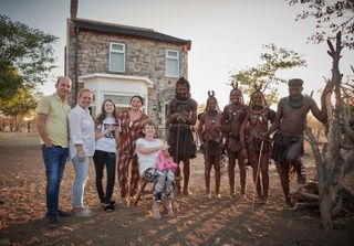 Scarlett Moffatt and family with Mboki, Muvii, Ueripanga, Kaitaarua and Kandisiko in front of their home-from-home in Namibia
