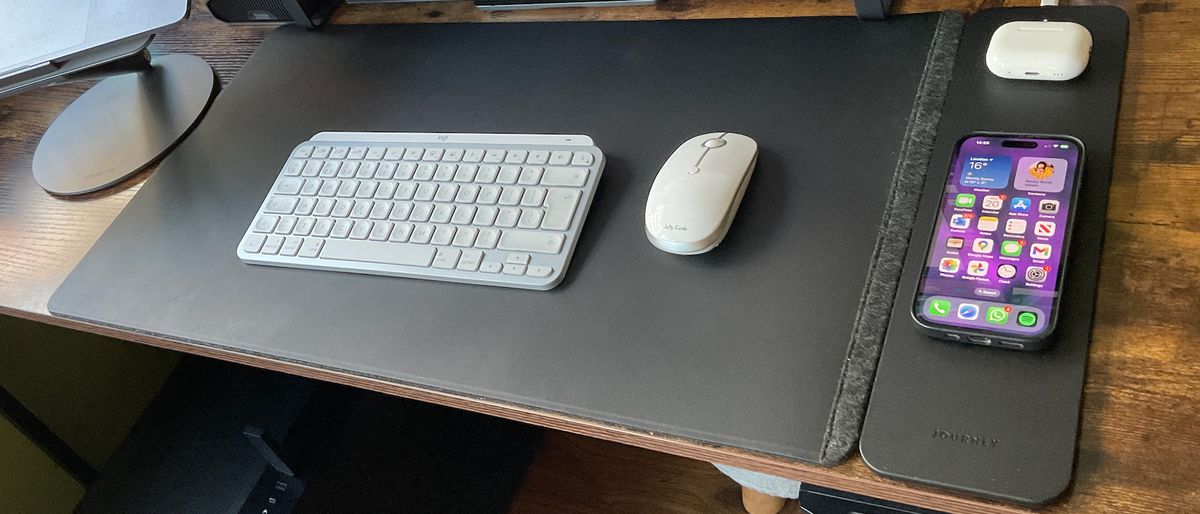 The Journey ALTI Wireless charging desk mat in a wood-lined office