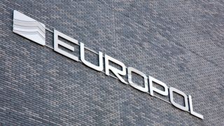 Image of a Europol sign affixed to its Amsterdam headquarters