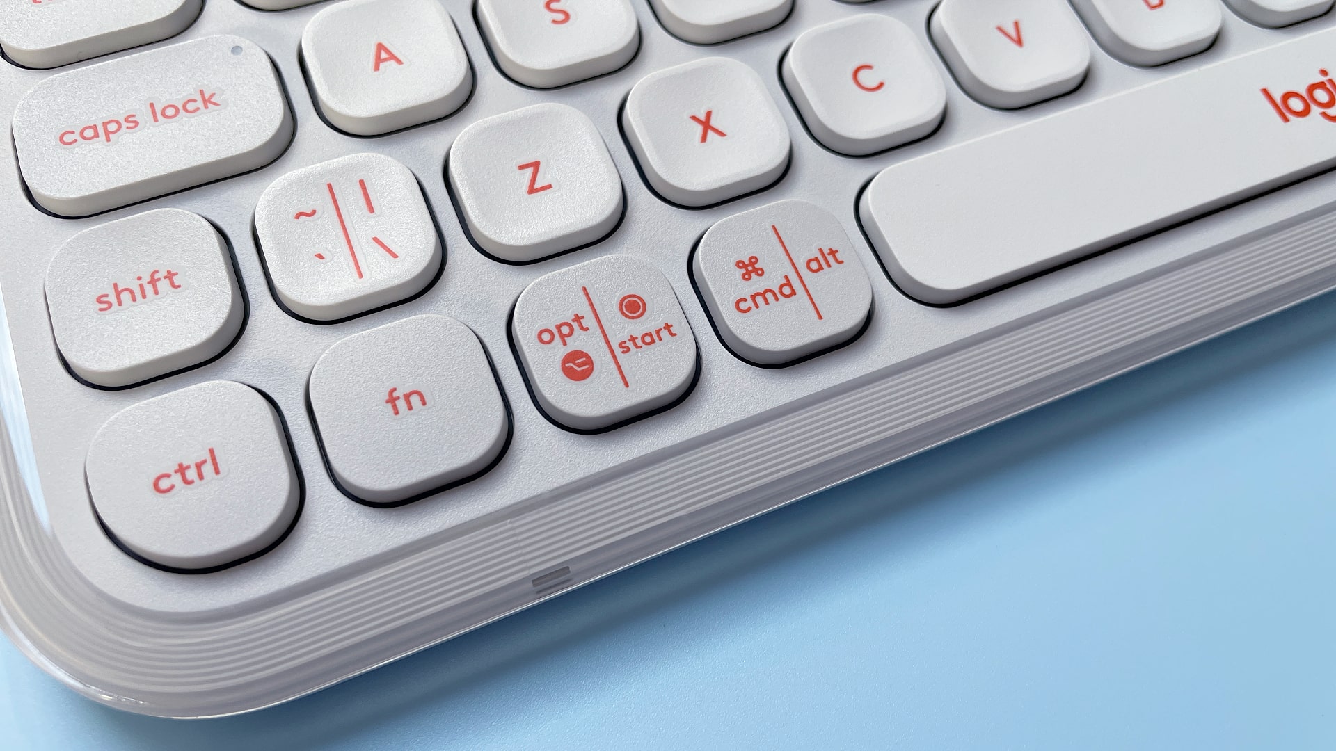 The Logitech POP Icon Keys keyboard against a blue background.