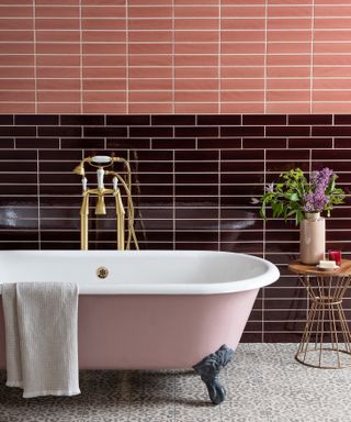 Colorful bathrooms, pink bath and vibrant tiles in a bathroom