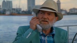 Willie Nelson on Miami Vice, holding a phone