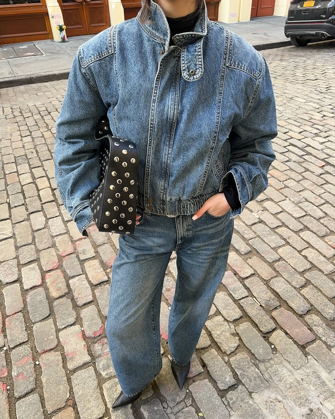 Woman wearing denim on denim outfit fall 2025.