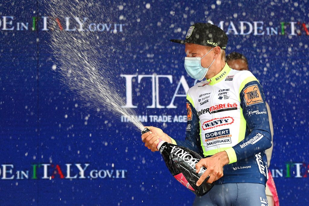 CANALE ITALY MAY 10 Taco Van Der Hoorn of Netherlands and Team Intermarch Wanty Gobert Matriaux celebrates at podium during the 104th Giro dItalia 2021 Stage 3 a 190km stage from Biella to Canale Trophy Champagne girodiitalia Giro on May 10 2021 in Canale Italy Photo by Stuart FranklinGetty Images