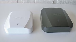 An overhead shot of the Wyze Mesh Router next to the Wyze Mesh Router Pro