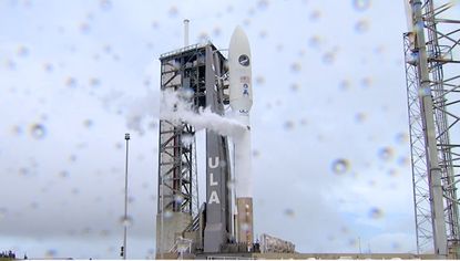 A United Launch Alliance Atlas V rocket carrying the X-37B space plane for the U.S. Space Force's OTV-6/USSF-7 mission stands atop a rainy launch pad at Cape Canaveral Air Force Base, Florida on May 16, 2020.