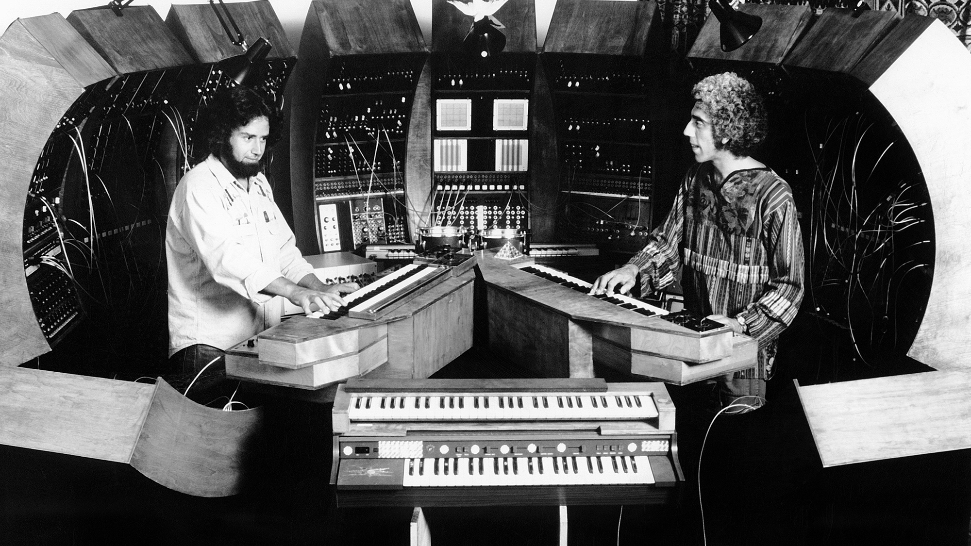 British jazz bassist Malcolm Cecil (right) and American producer Robert Margouleff of the pioneering electronic music duo TONTO aka Tonto's Expanding Head Band (Tonto stands for The Original New Timbral Orchestra) perform live circa 1974.