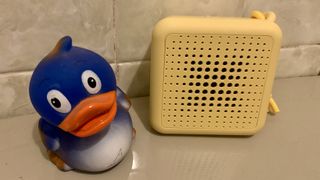 IKEA Vappeby Bluetooth speaker next to a rubber duckie, in a bathroom