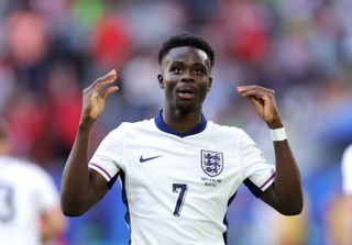 Bukayo Saka celebrates his equaliser for England against Switzerland at Euro 2024.