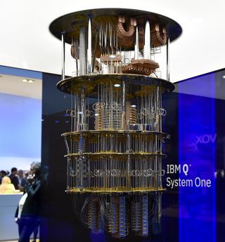 A cylindrical computer with many complex, small structures on display at a convention