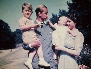 Princess Elizabeth with her husband Prince Philip, Duke of Edinburgh, and their children Prince Charles and Princess Anne, August 1951