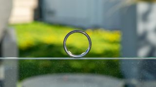 Oura Ring 5 on a glass panel