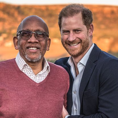 Prince Harry and Prince Seeiso of Lesotho smiling in front of a mountain