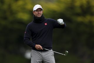 Adam Scott lines up an iron shot