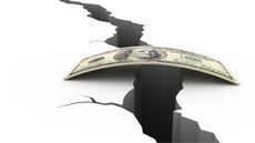 A small stack of hundred-dollar bills stretched over a gap.