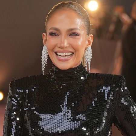 Jennifer Lopez wore a black sequin gown with a neon pink skirt at the Office Romance premiere in London