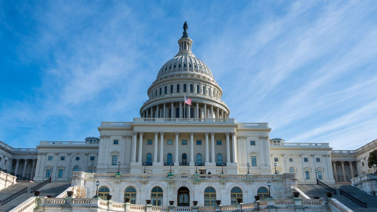 The US Capitol building on a sunny day.