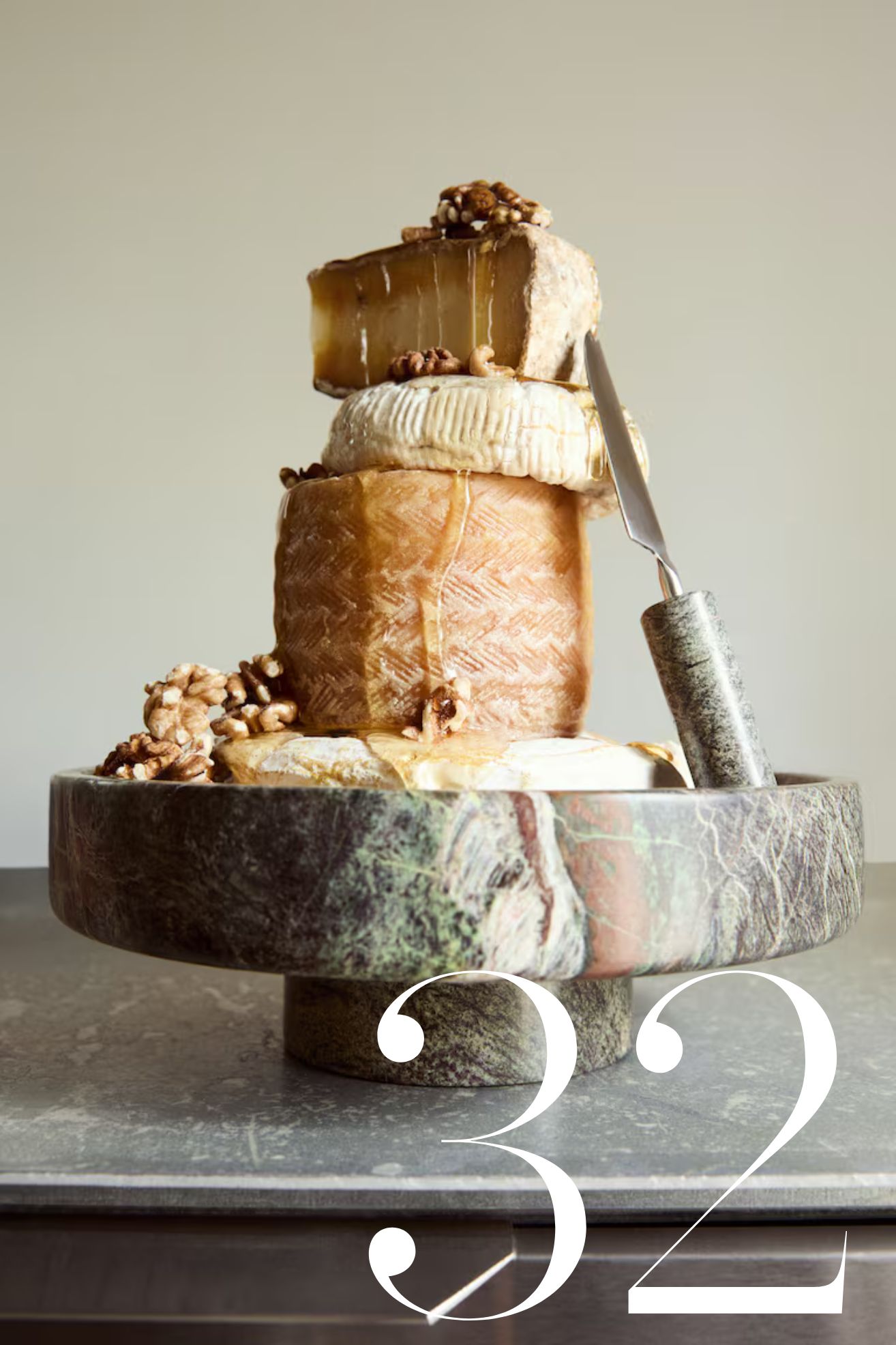 marble pedestal bowl with stacks of cheese