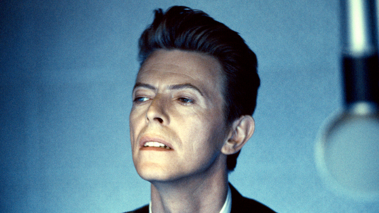 David Bowie in a studio looking wistfully off camera