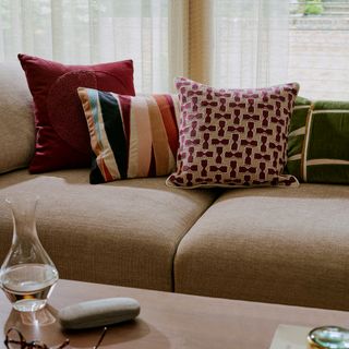 Cream sofa with patterned cushions