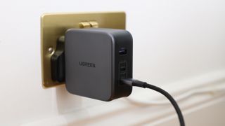 Ugreen Nexode 140W charger in a wall socket