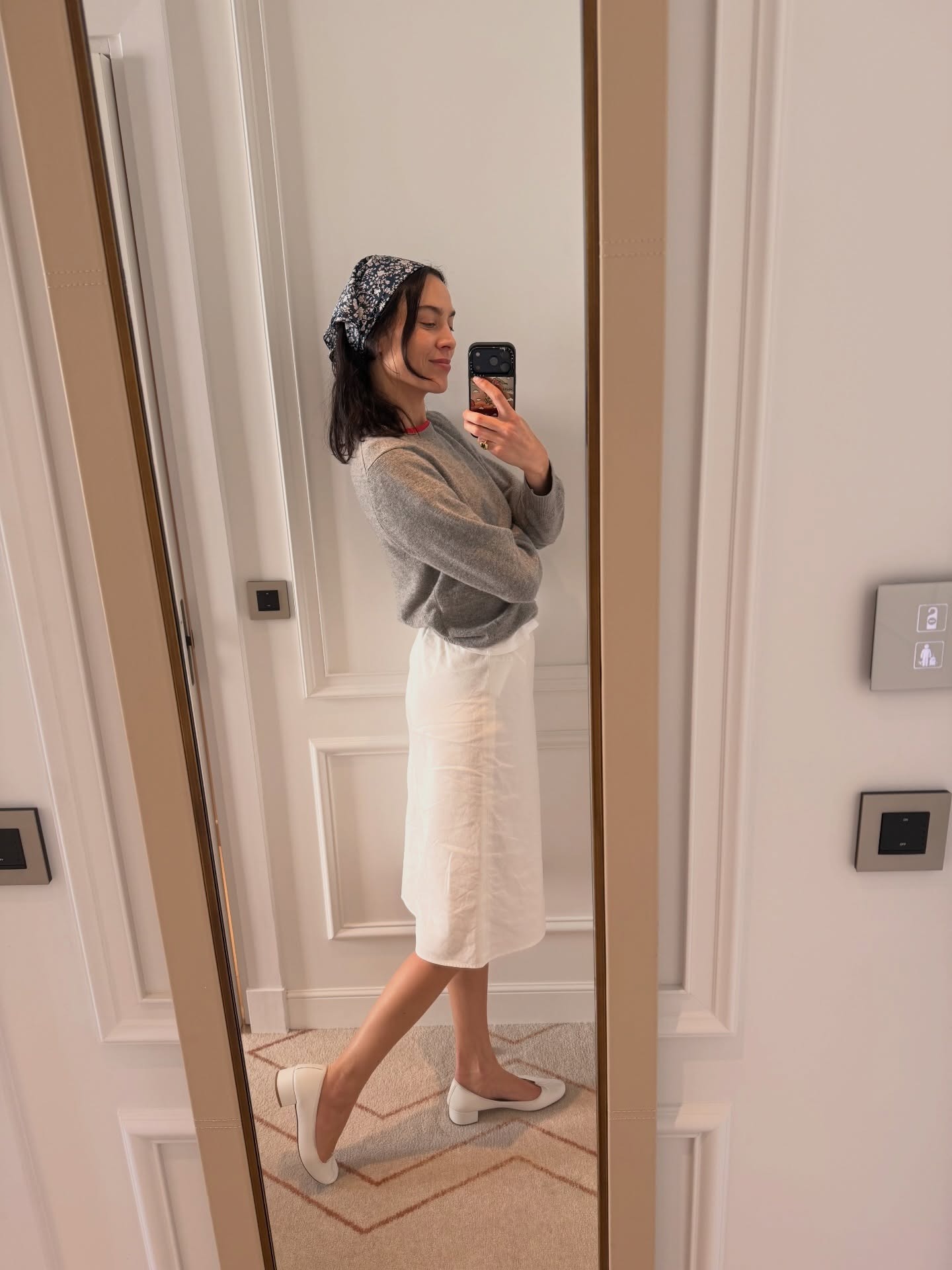 Alexa Chung wears a heeled ballet flat and mini skirt.