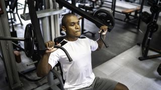Man doing strength workout at gym