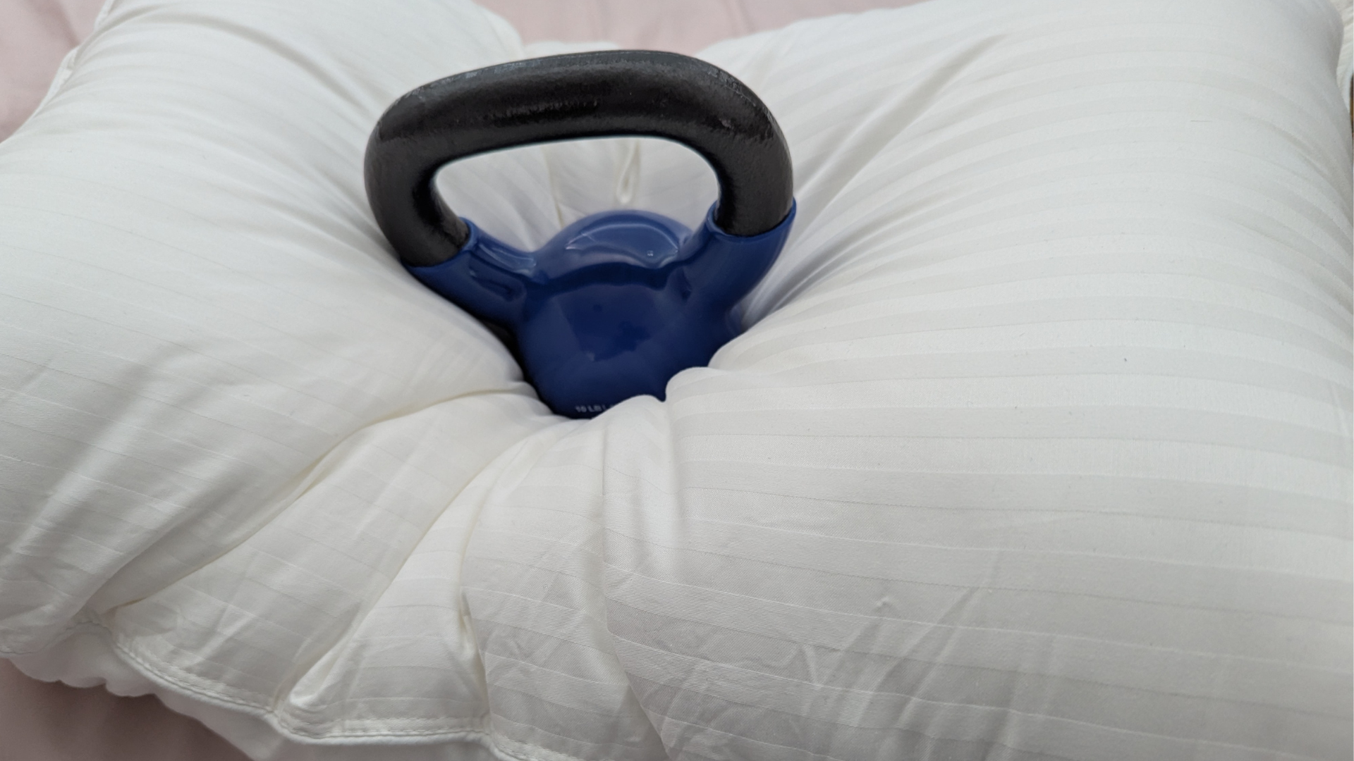 A 10 lb weight placed on the center of the Beckham Hotel Collection down-alternative pillow an objective test to gauge comfort and support