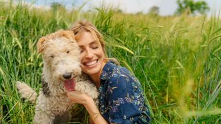 Woman hugging a dog