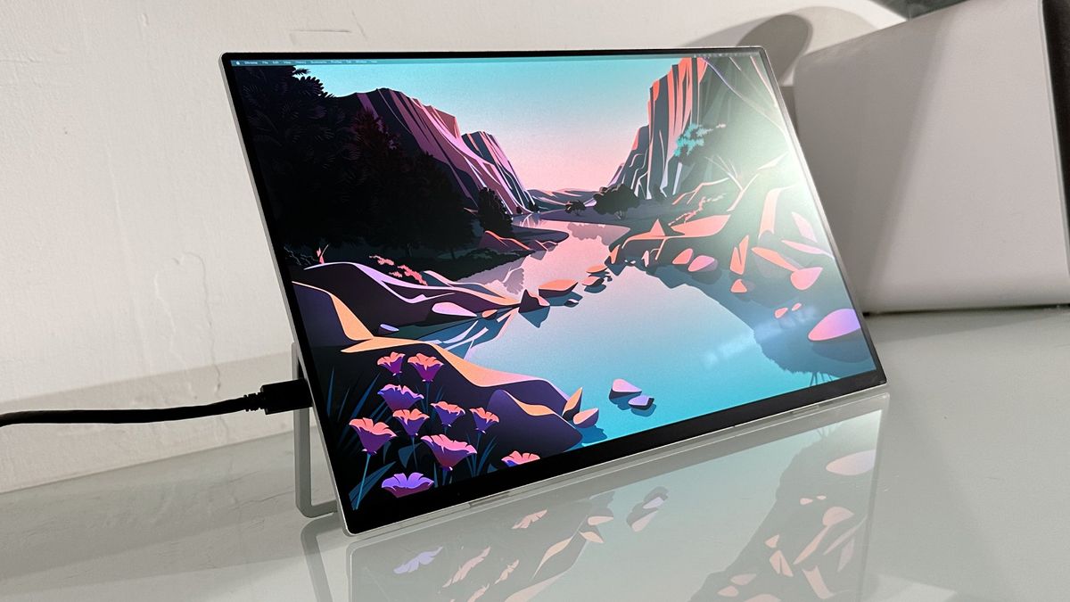 Testing the Acer ProDesigner PE160WUT in a home office next to a MacBook