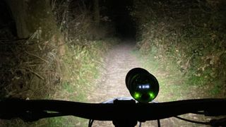 Rear view of Exposure Six Pack Mk12 mounted on handlebars in use at night
