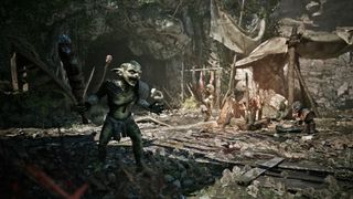 In Gothic 1 Remake, a goblin stands in the center of a camp holding a cudgel while two other goblins sit around a fire