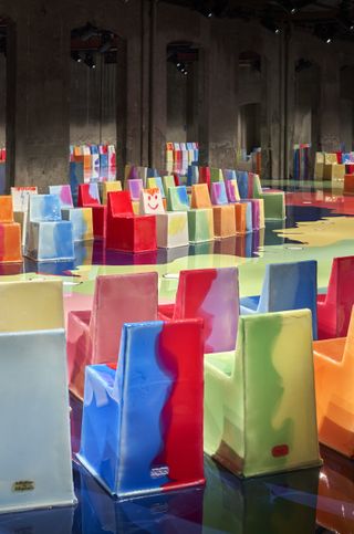 Gaetano Pesce’s set for Bottega Veneta with bright, colourful chairs along the runway