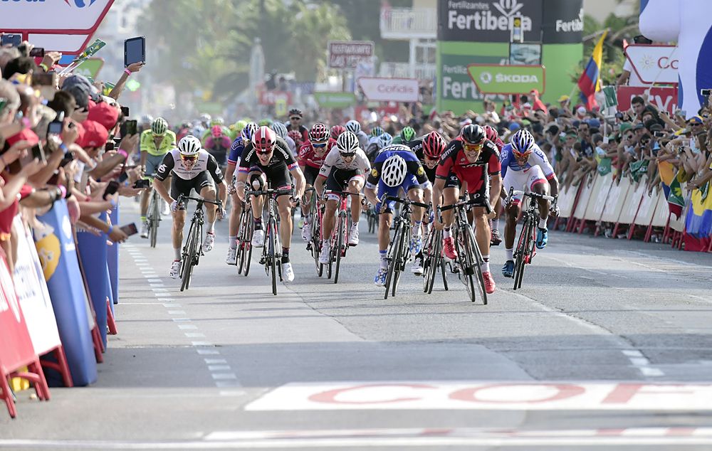 BMC Racing Team's Luxembourgian cyclist Jean-Pierre Drucker (2nd R) sprints to win the 16th stage of the 71st edition of 'La Vuelta'