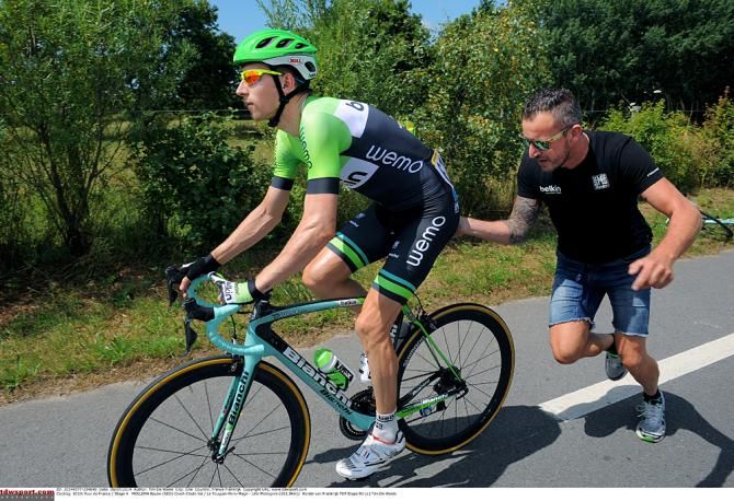 Bauke Mollema (Belkin) gets a push back into the race after he crashed during stage 4